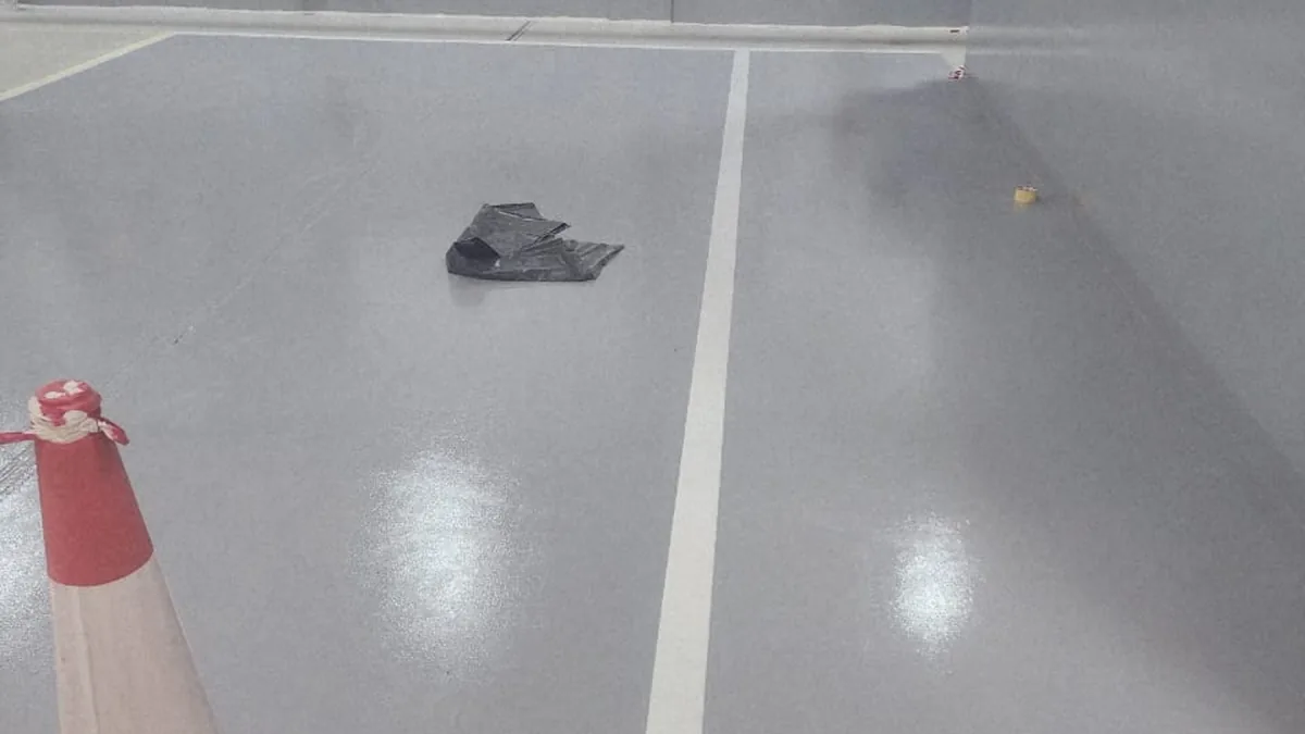 Completed grey epoxy floor zone with white line marking